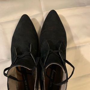 Flat black leather booties